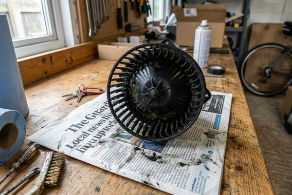 Removed blower wheel with heavy mould buildup