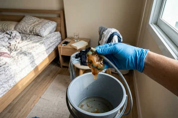 Slime pulled from a blocked aircon drain hose